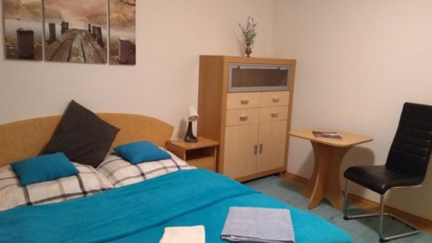 Spálňa v apartmáne na poschodí